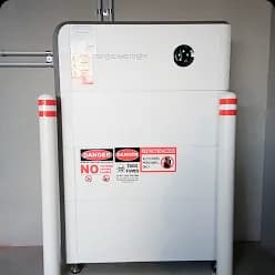 White solar battery between red and white bollards in a Brabham, WA garage