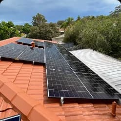 Solar panels on a terracotta tile roof in Leda, WA