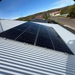 Solar panels on a corrugated roof overlooking the street in Salisbury East, SA