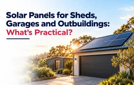 Solar panels installed on the roof of a garage and a small shed at sunset